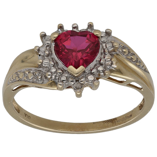 Gold ring with oval red ruby center, diamond halo and small accent stones