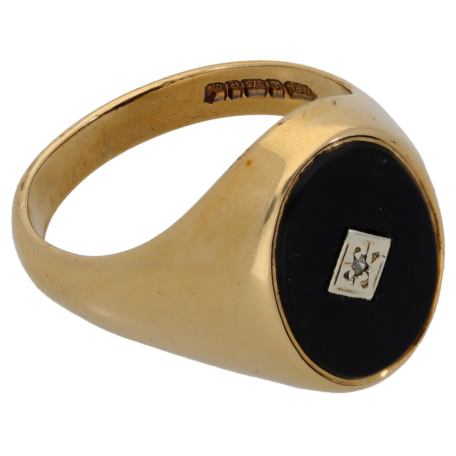 Gold signet ring with black onyx set oval face and visible side engraving