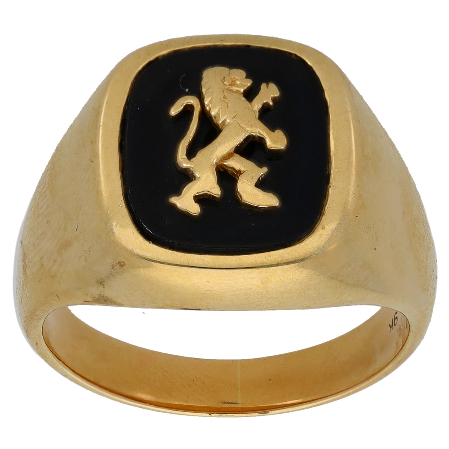 Gold signet ring with black onyx inset and gold crest emblem, front view