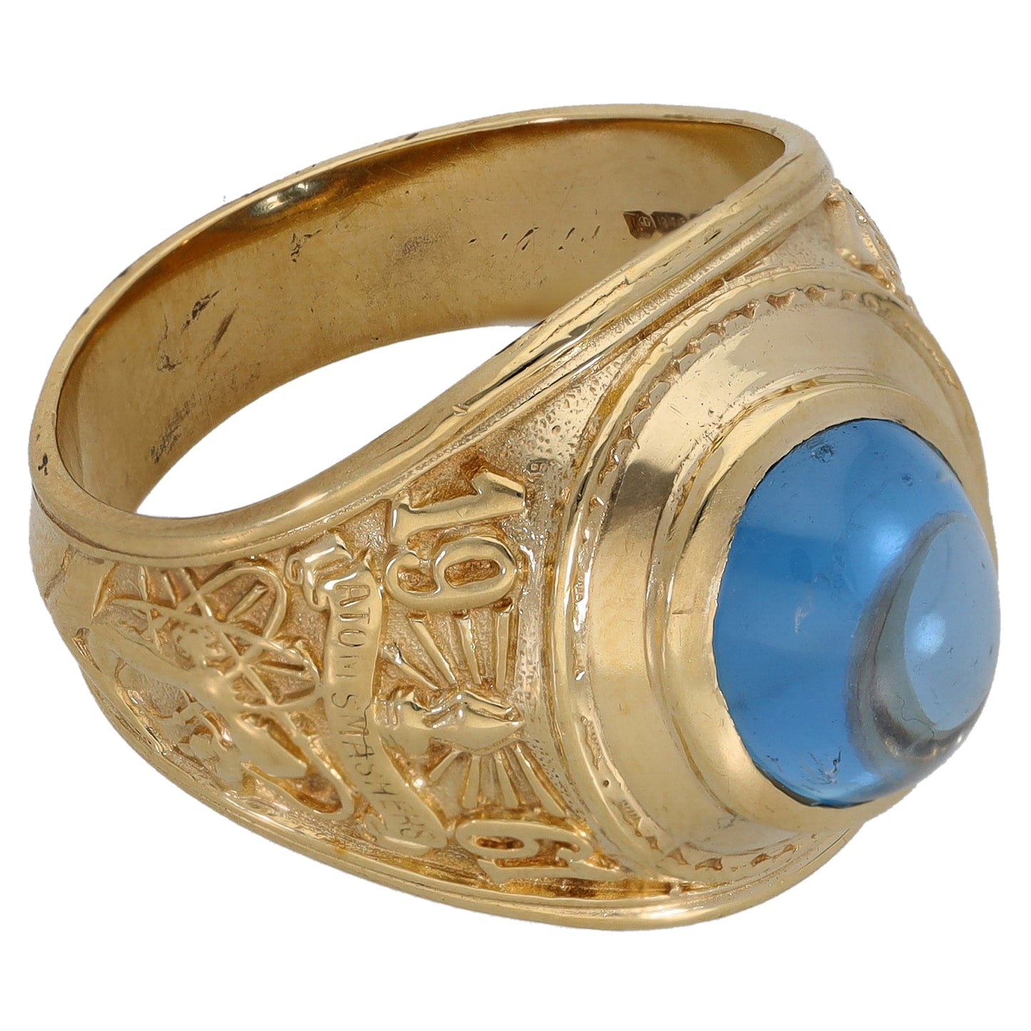 Gold-tone ring with oval blue single stone, side view, ornate engraved band