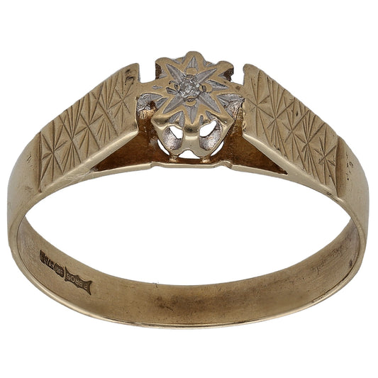 Gold solitaire ring with textured band and round diamond center setting