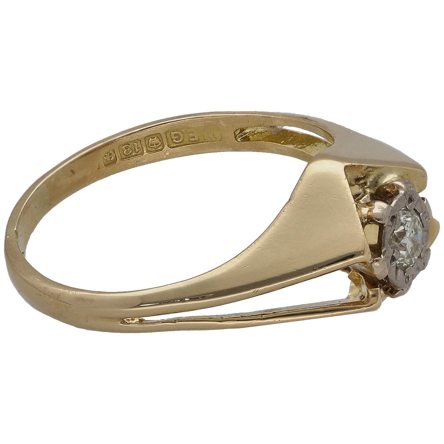 Gold ring side view with four-prong round diamond solitaire and engraved inner band