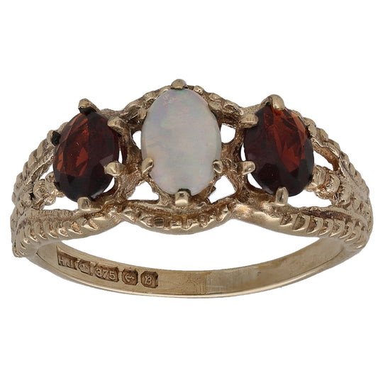 9ct gold opal and garnet ring with two dark red side stones, front view