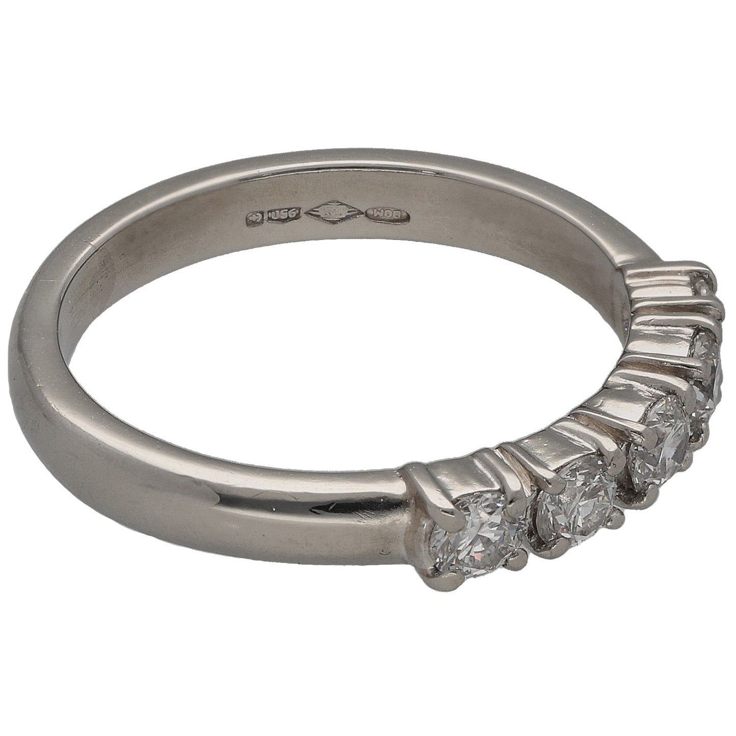 Platinum diamond ring showing engraved inner band and side stones with prong setting