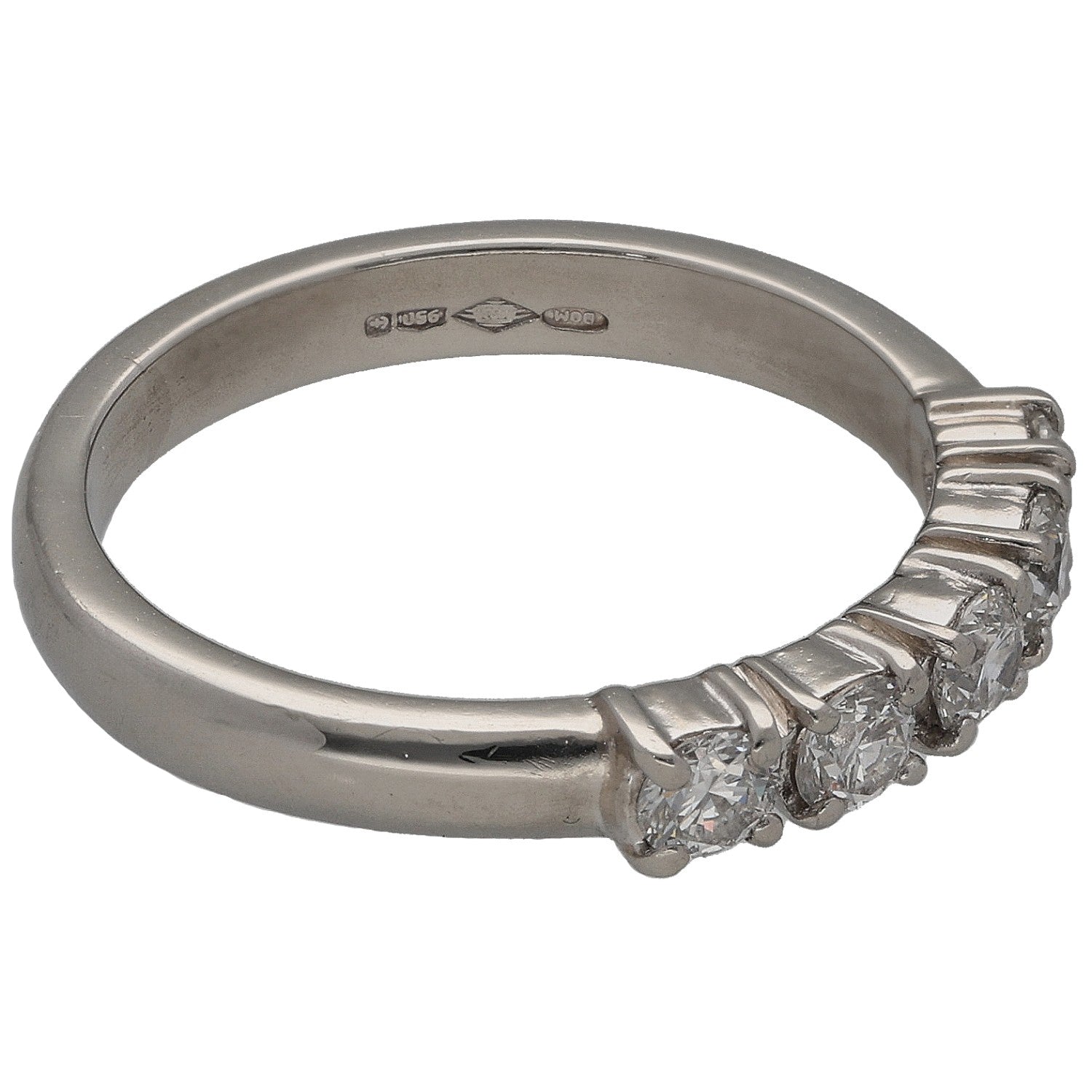 Platinum diamond ring showing engraved inner band and side stones with prong setting
