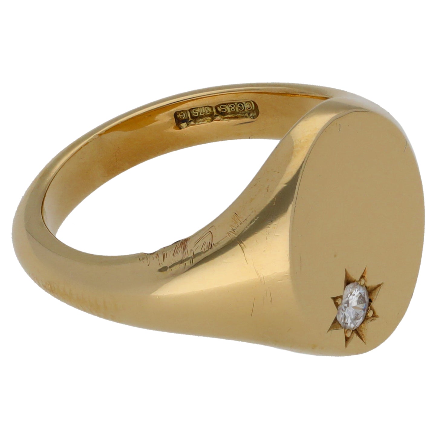 Yellow gold signet ring with star-set round diamond on the bezel