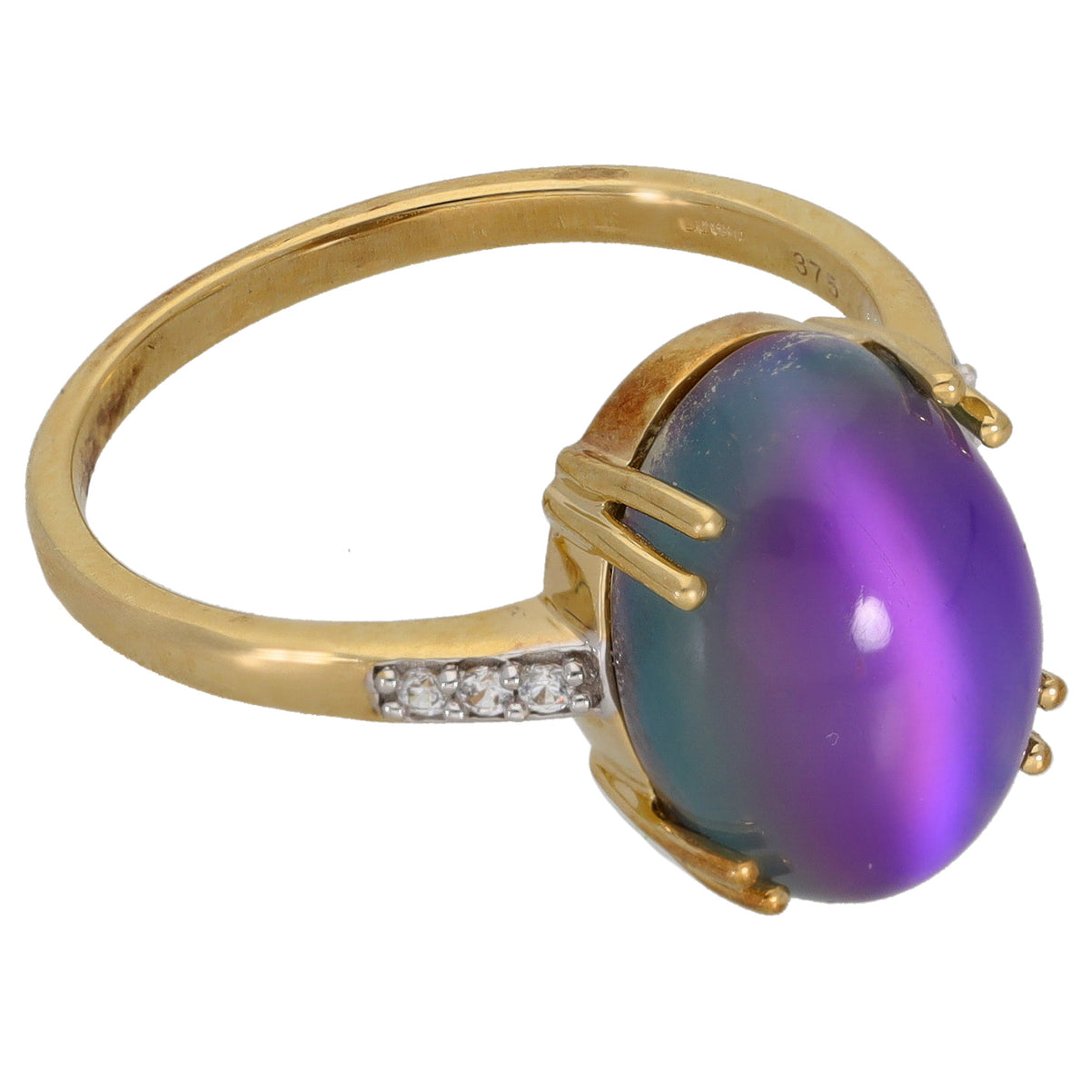 Gold-tone cocktail ring with oval purple cabochon, prong setting, and crystal band