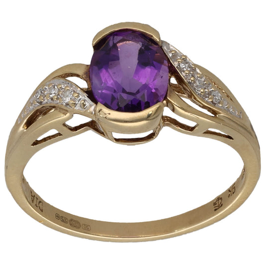 Gold amethyst cocktail ring with round purple center stone and diamond pave shoulders