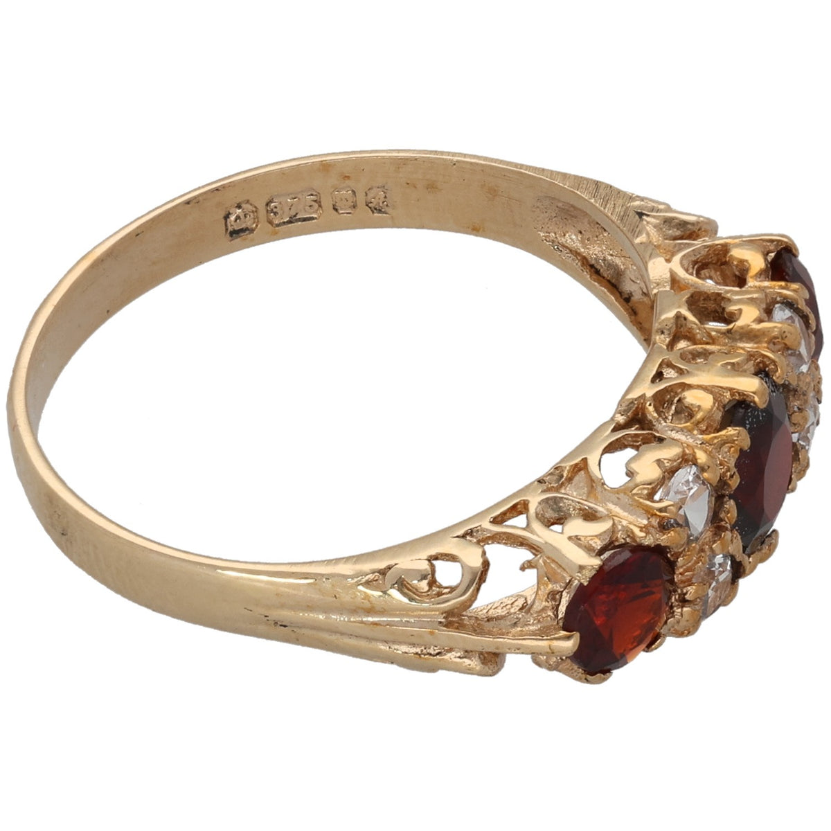 Gold cocktail ring with red stones and clear crystals; filigree band with metal hallmarks