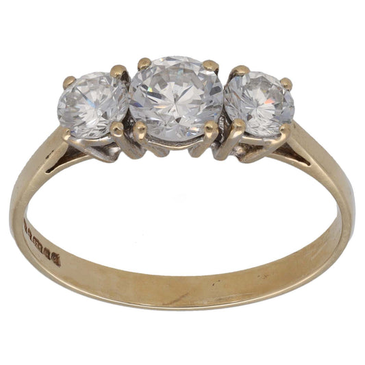 Gold-tone three-stone CZ ring with three round clear stones on a slim band