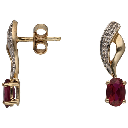 Gold earrings with oval ruby center and round diamond halo bezel