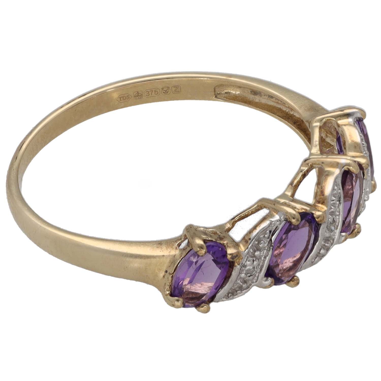 9ct gold ring side view with purple oval amethysts in prong and split diamond set