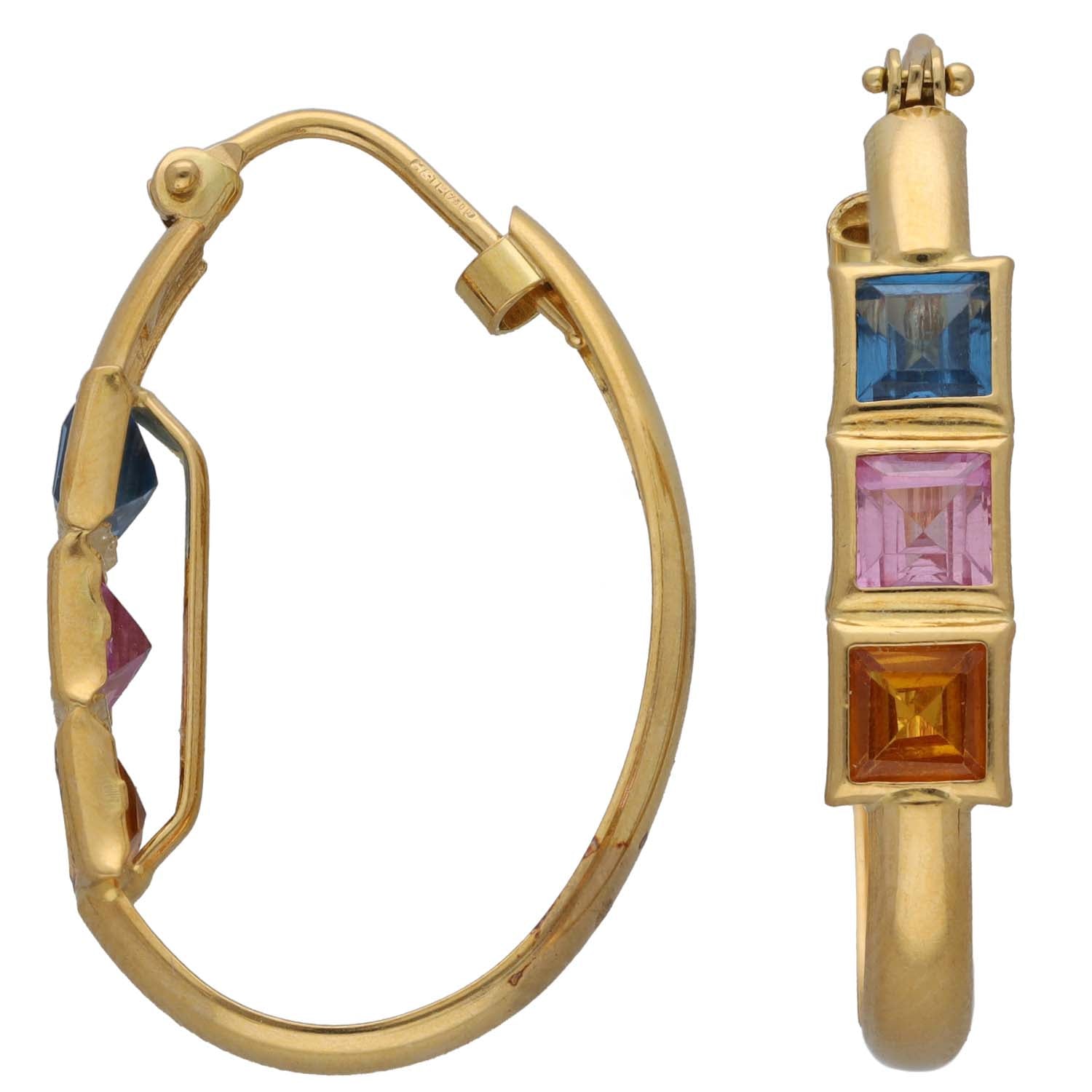 Gold-tone hoop earrings with dangling square accents in blue, purple, and amber