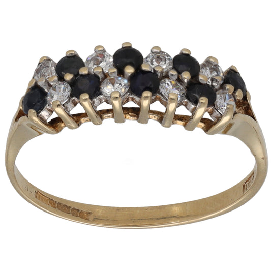 Gold cocktail ring with black and clear CZ stones across the top