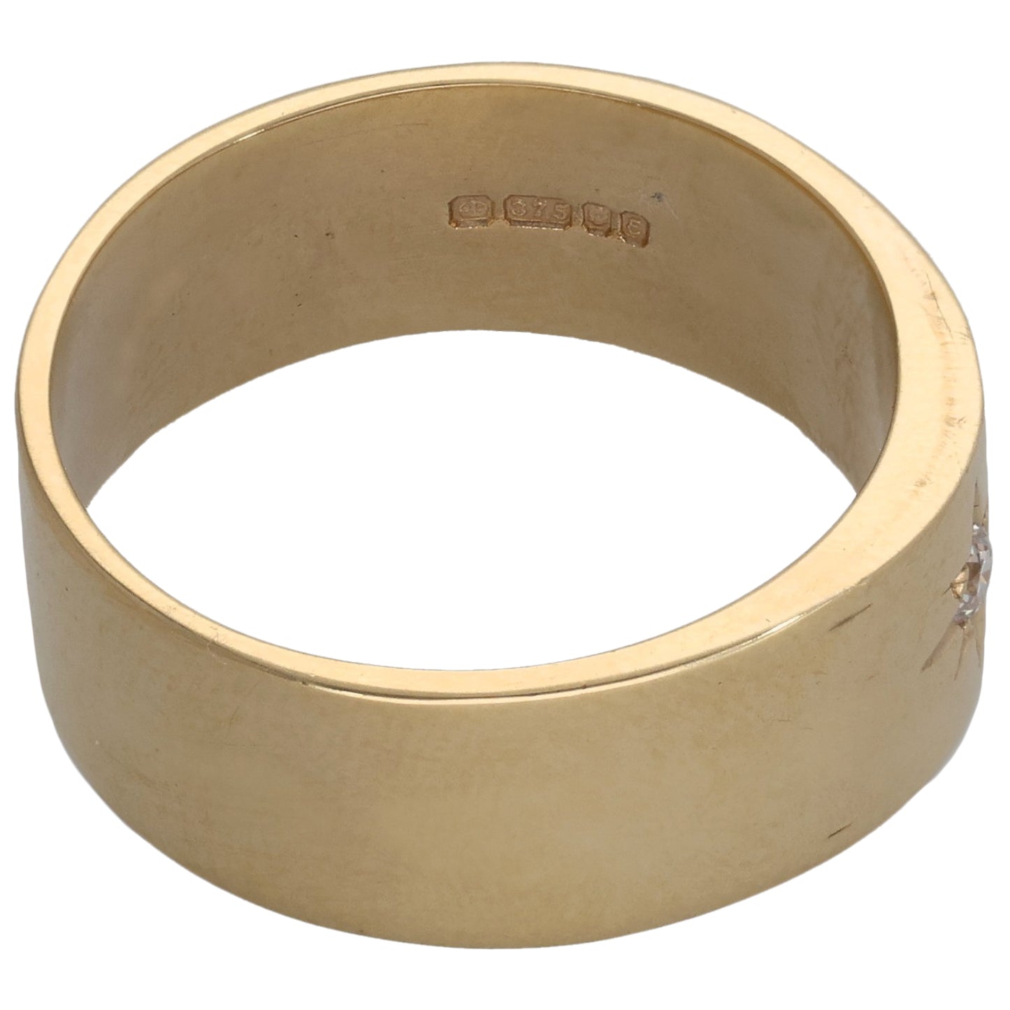 Gold-tone band ring with inner hallmark and smooth polished finish
