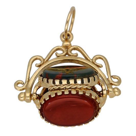 9ct gold fob pendant with red oval stone and dark stone, openwork scroll setting
