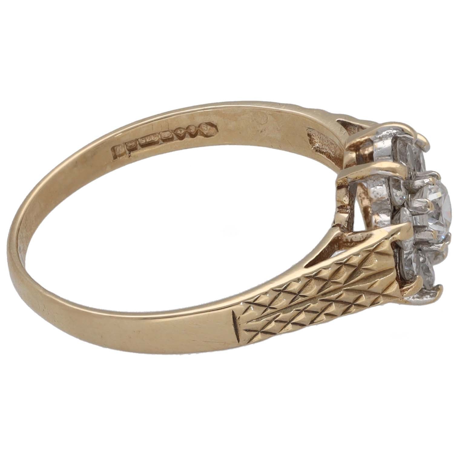 Gold tone ring with textured band and side CZ cluster, size N