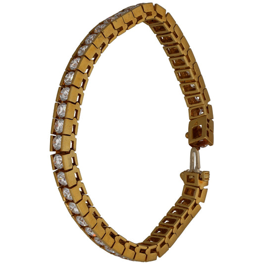 Gold tennis bracelet with round diamonds, open link design, box clasp end visible