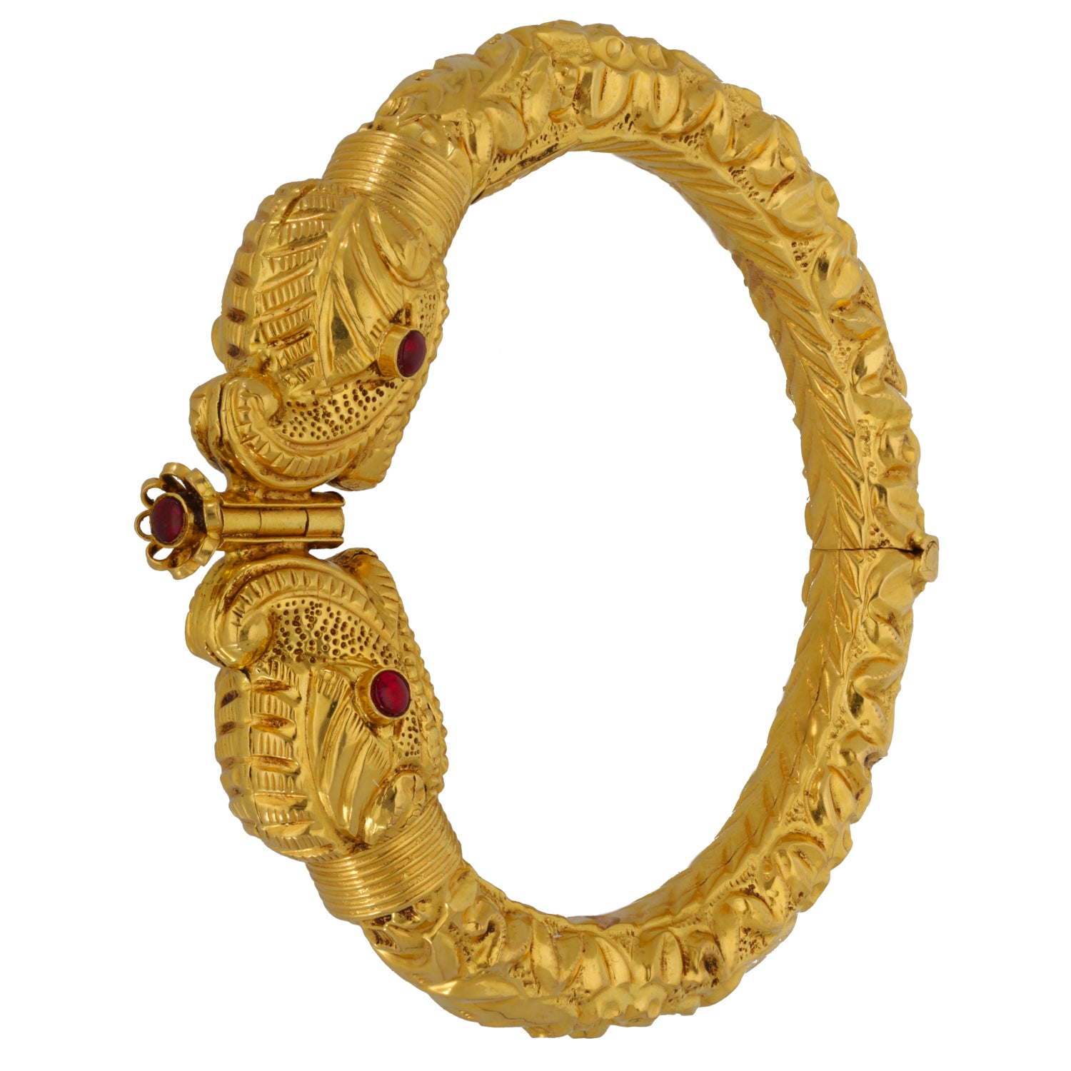 22ct Gold-tone hinged bangle with detailed carvings and red stones near clasp hinge