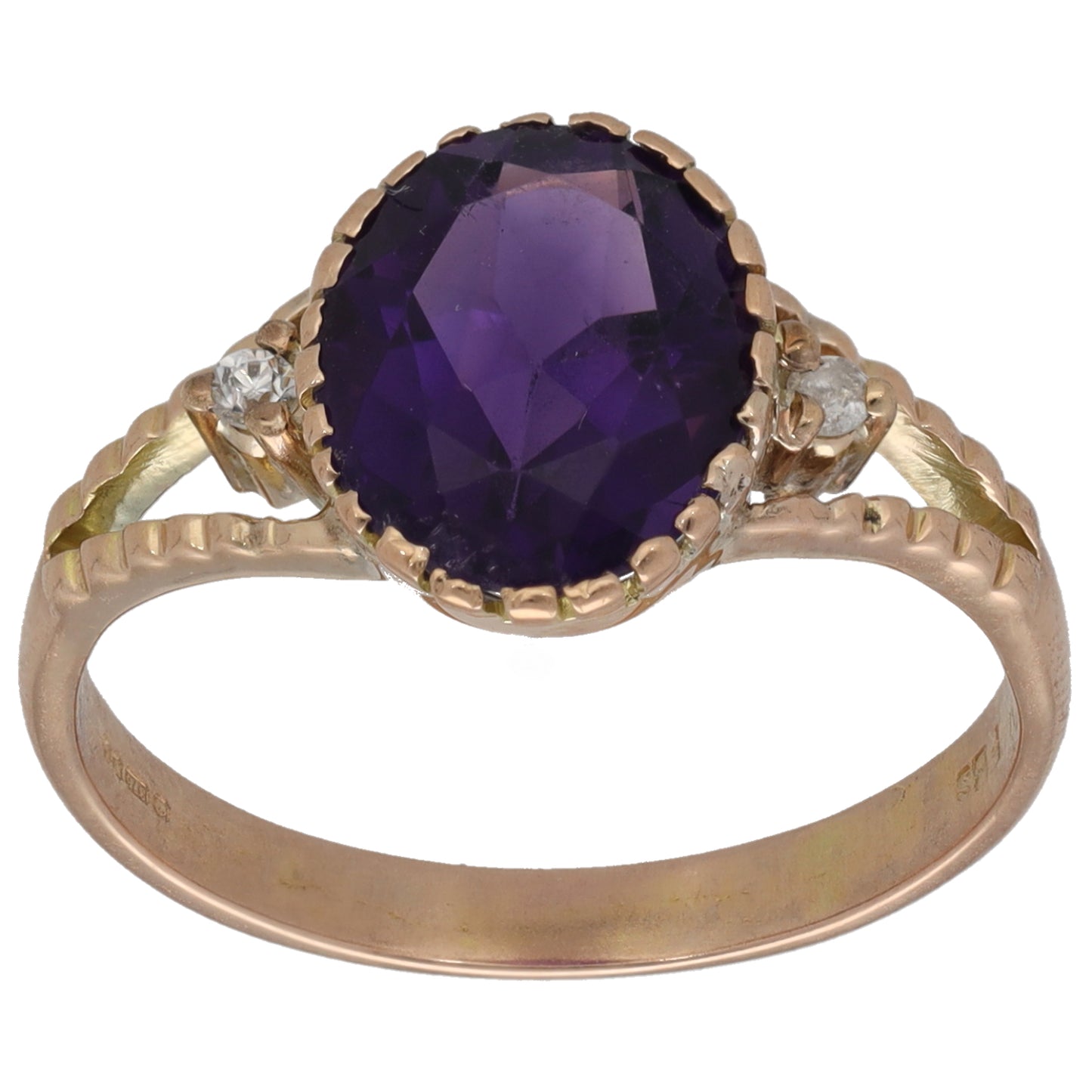 Rose gold tone single-stone ring with large dark purple oval centerpiece and clear side stones