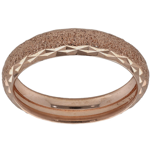 Rose gold patterned wedding ring with faceted edge and textured outer band