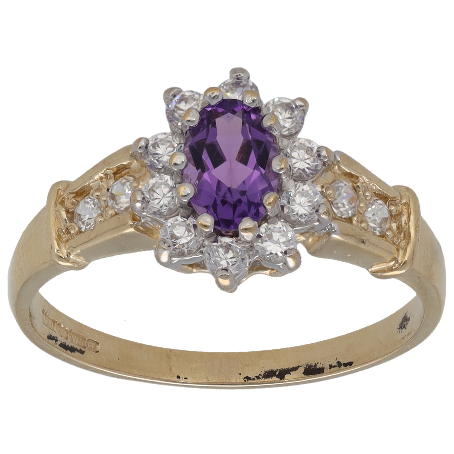 Gold ring with oval amethyst center and white CZ halo cluster