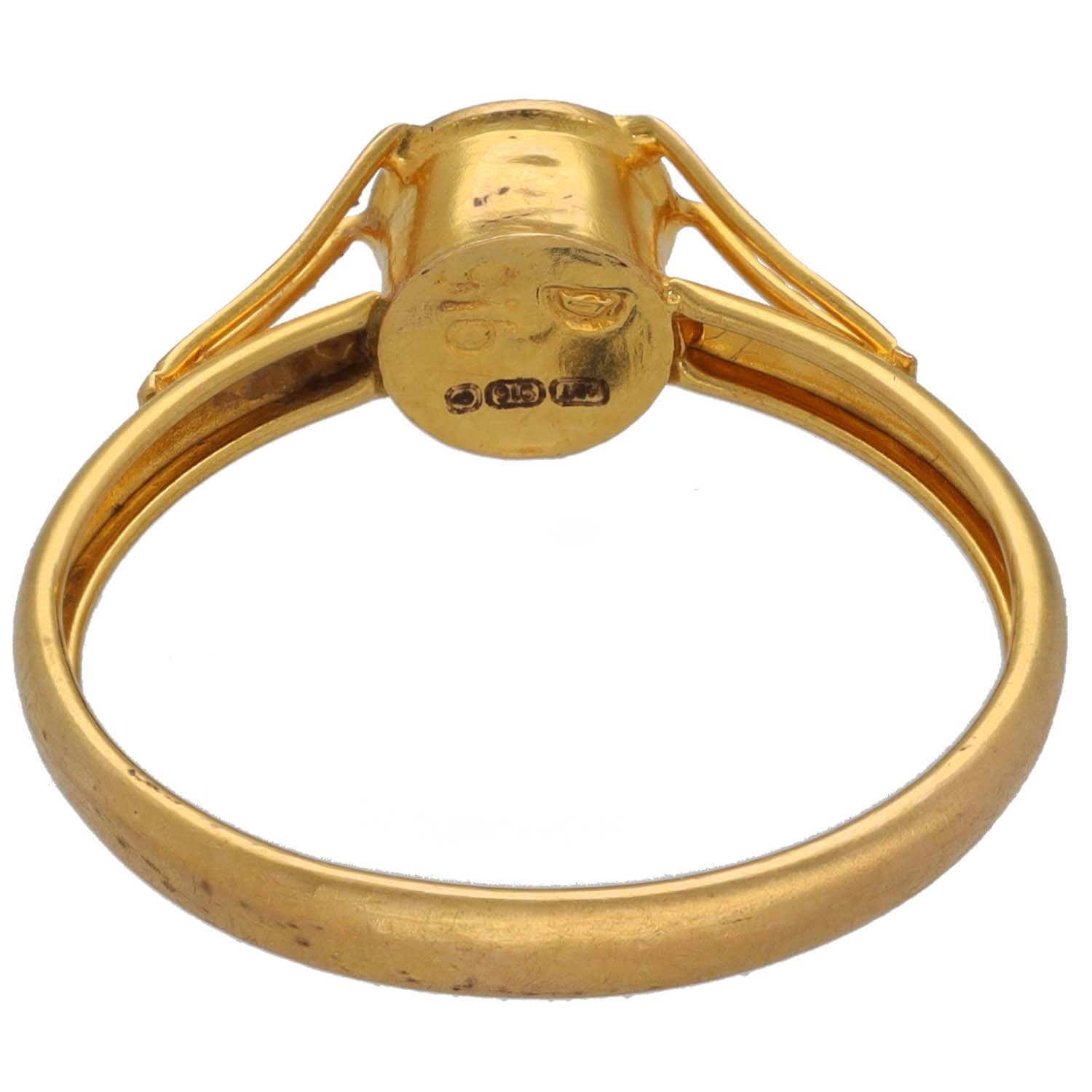 Gold CZ single-stone ring back view with rounded bezel and stamped hallmarks