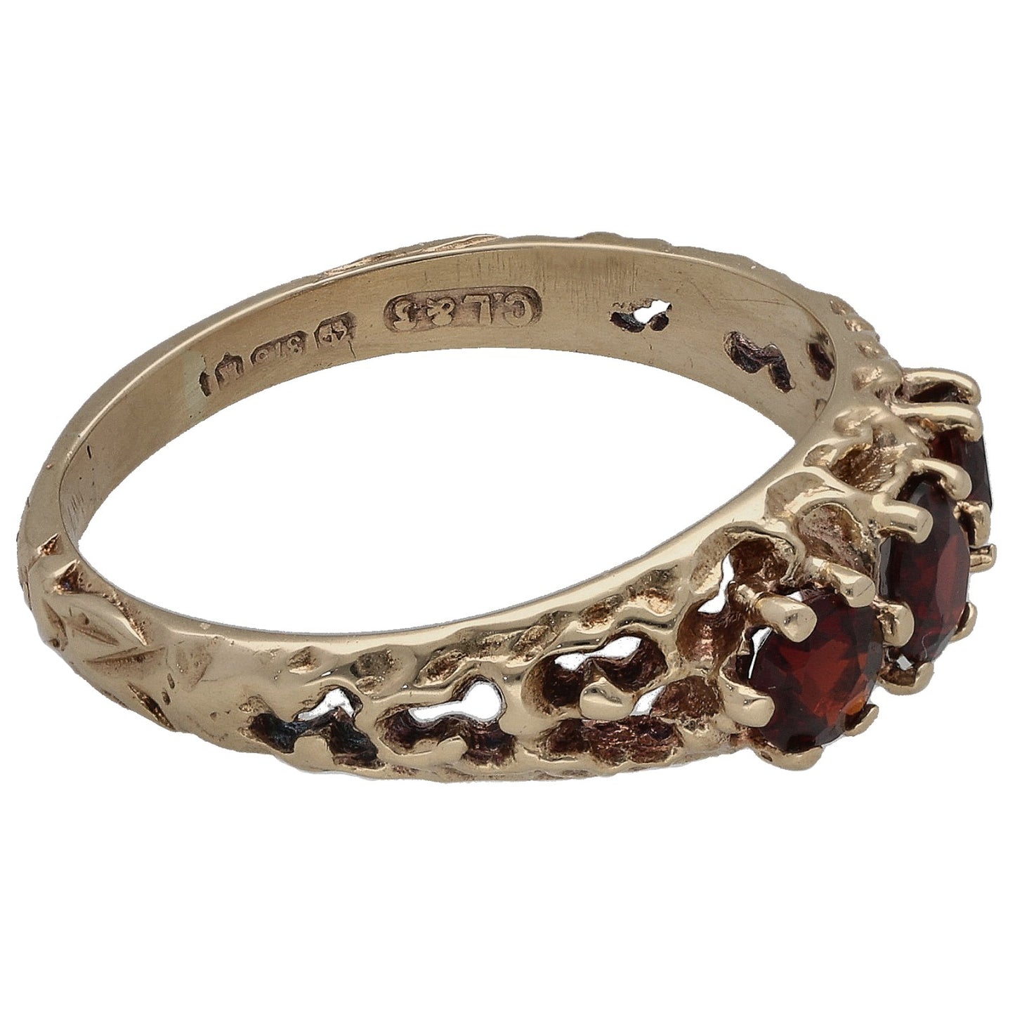 9ct gold three-stone ring side view; garnets set in claw prongs with inner hallmark