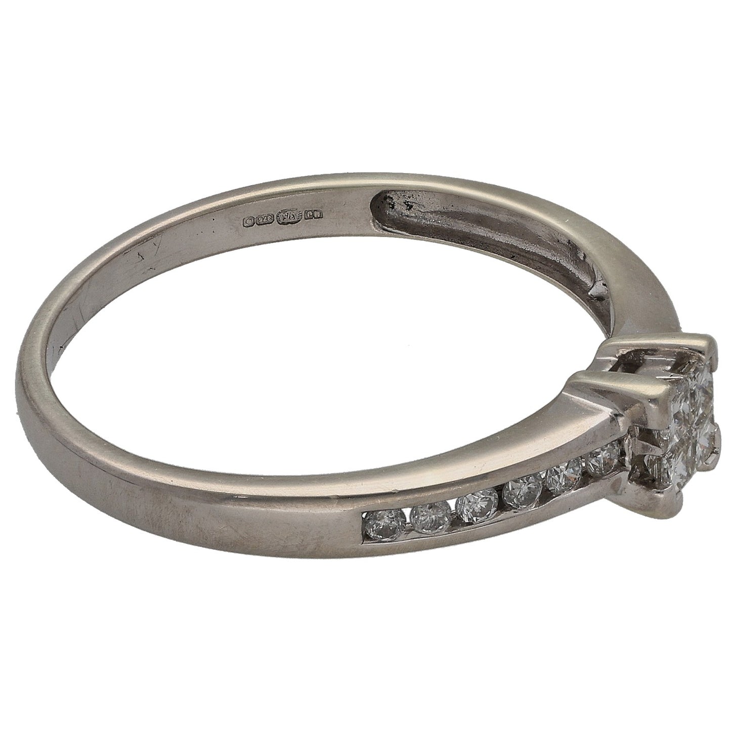 White gold diamond ring side view with princess center and curved row stones