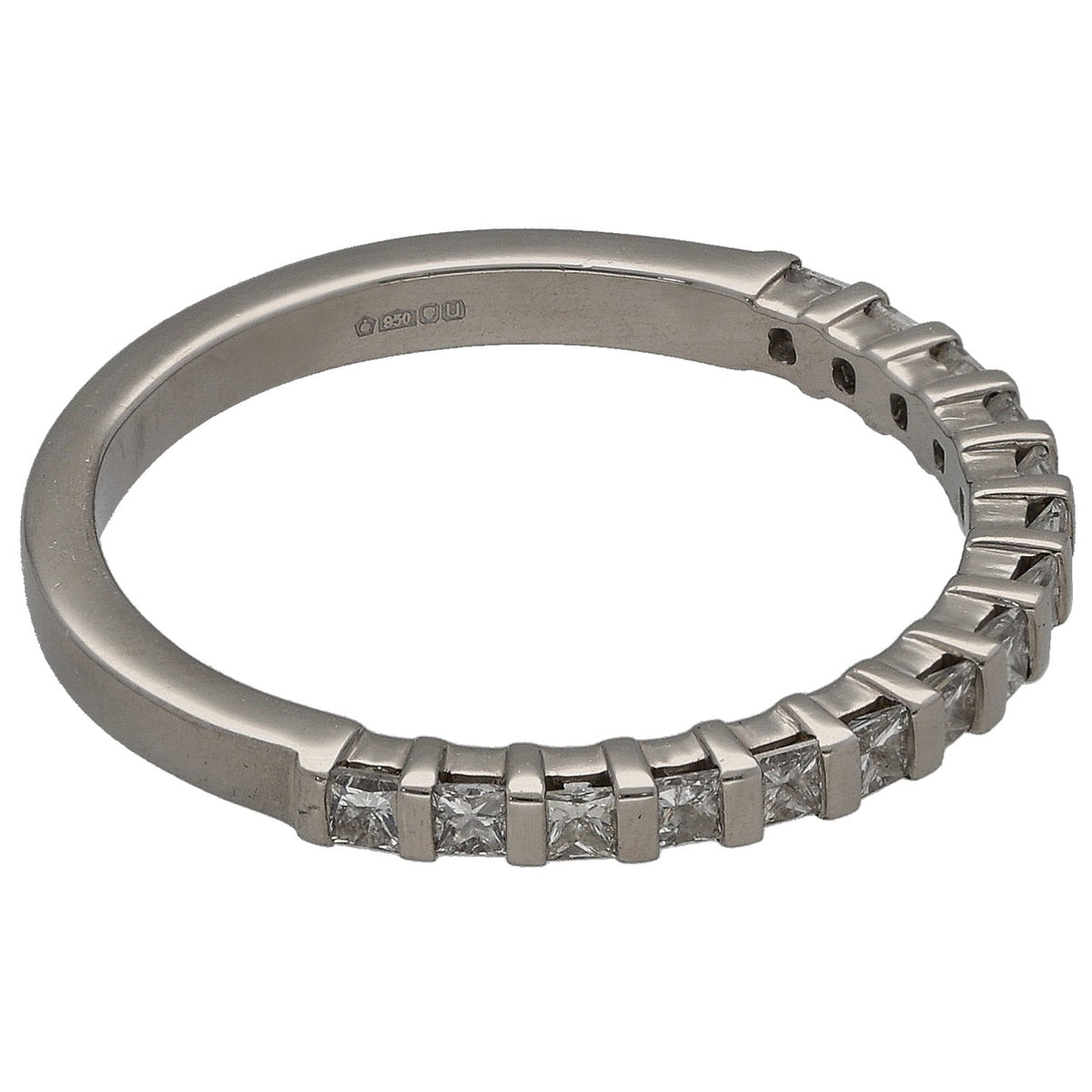 Platinum half-eternity ring showing side view of square diamond settings and markings