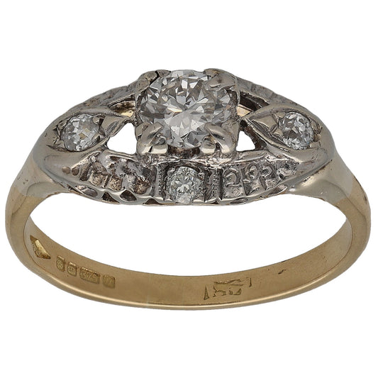 Gold diamond solitaire ring with round stones, detailed prong setting