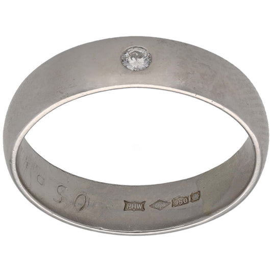 Platinum plain wedding band with round diamond set on top