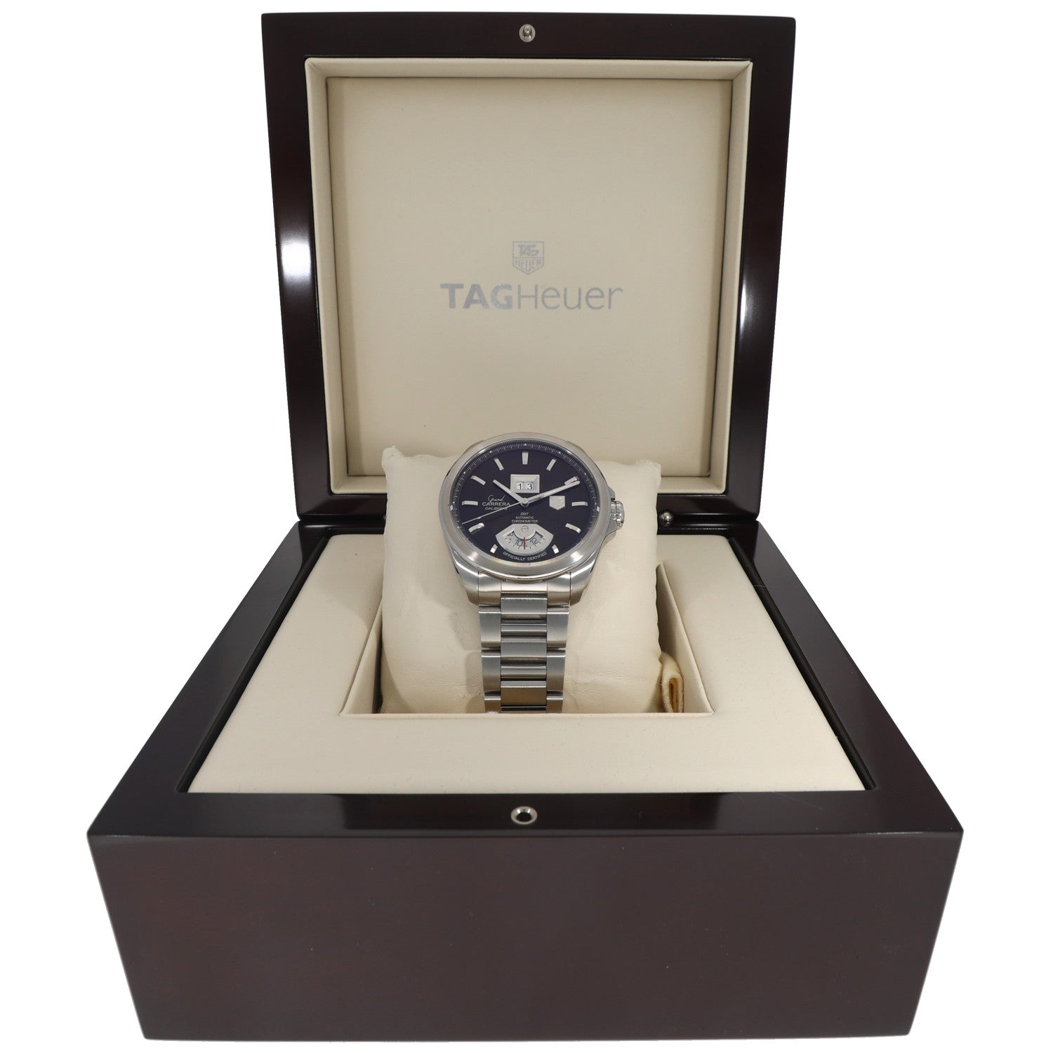 Tag Heuer Carrera WAV5113 watch in box, stainless steel bracelet and dark dial on pillow.