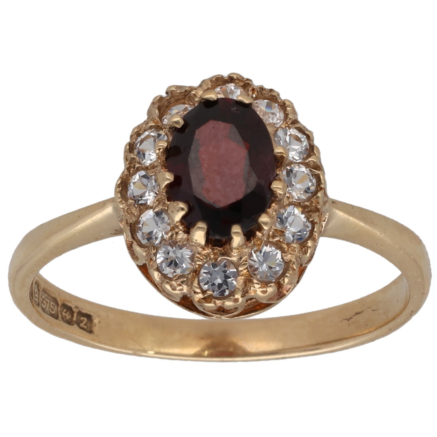 Gold-tone cocktail ring with oval dark red gem and clear stone halo