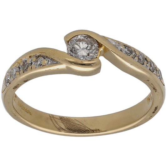 Gold solitaire ring with round center diamond and side accent stones