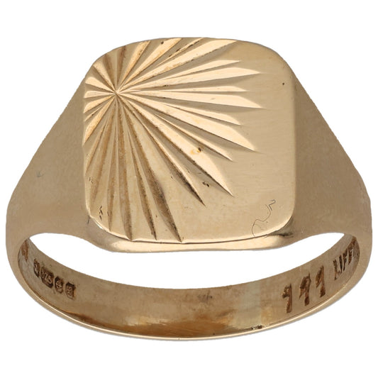 Gold signet ring with faceted sunburst-style engraved pattern on top