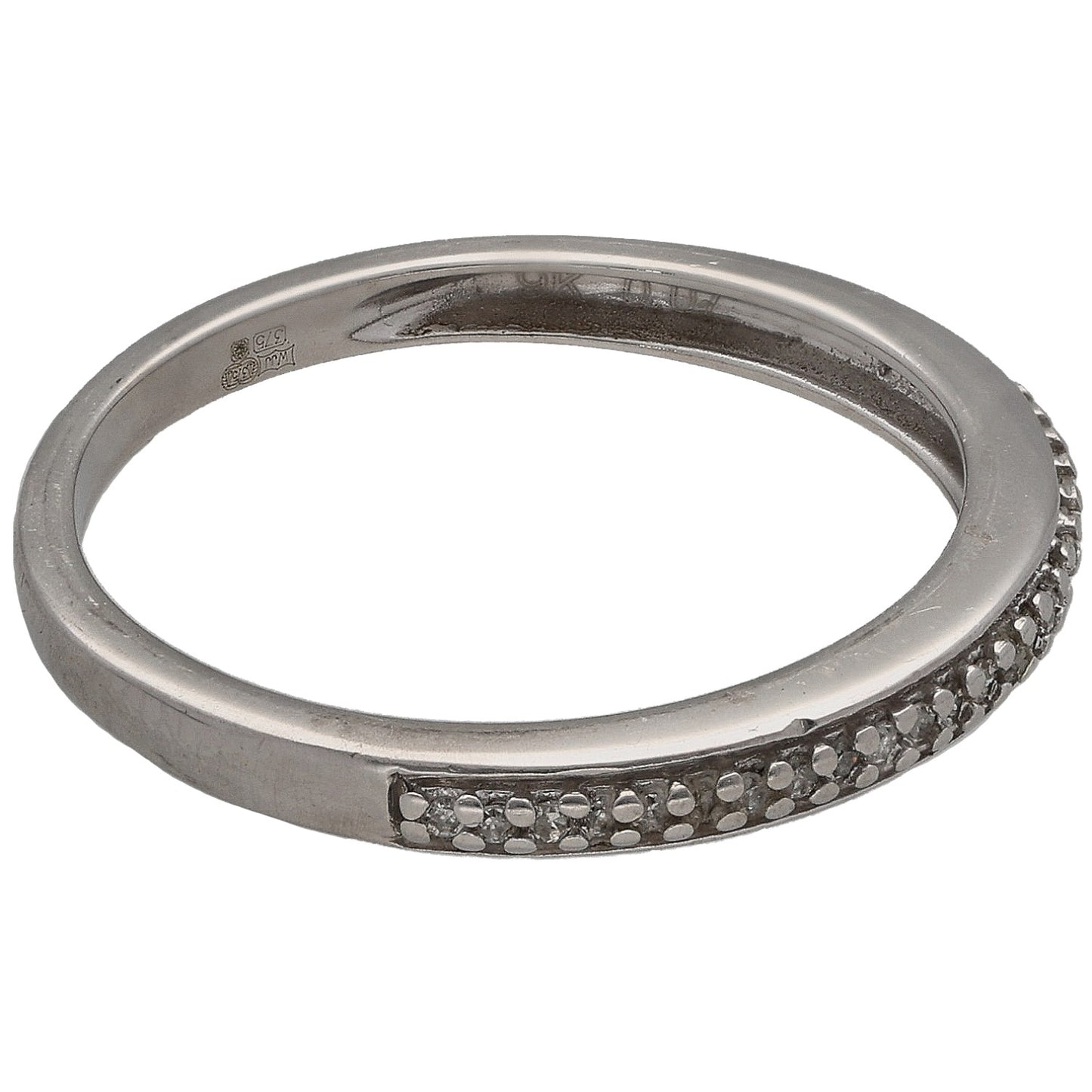 White gold half eternity ring with round diamonds along one side