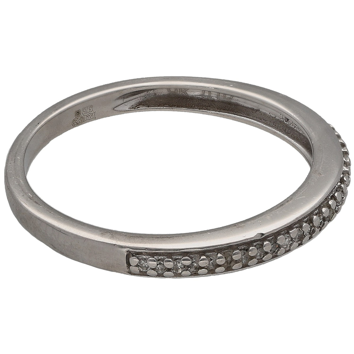 White gold half eternity ring with round diamonds along one side