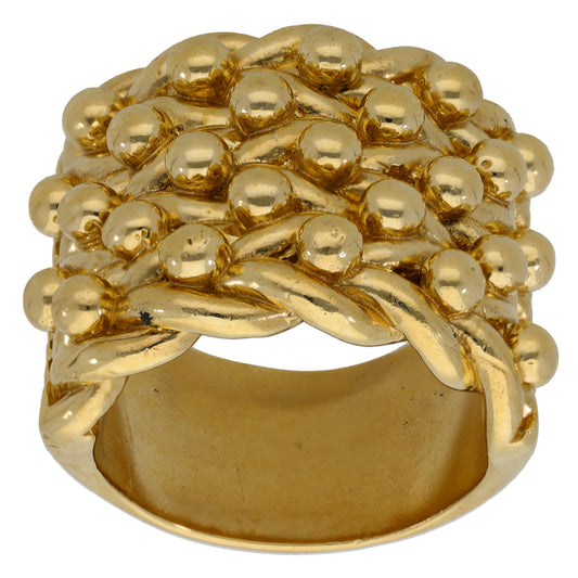 Gold keeper-style ring top with woven pattern, ribbon curves, and bead accents
