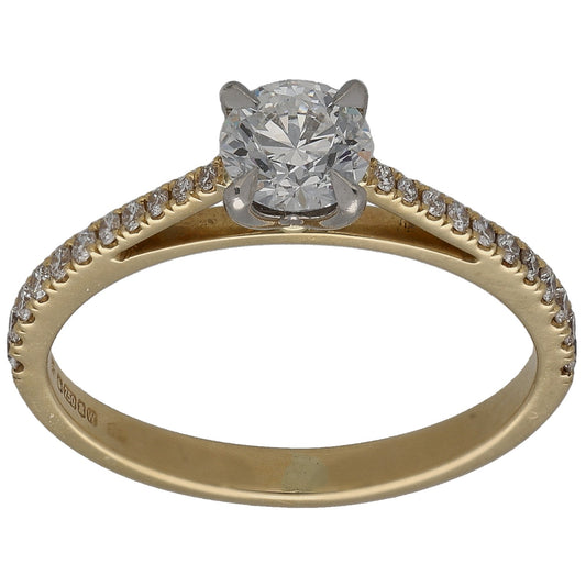 Gold solitaire diamond ring with round center stone and small accent stones