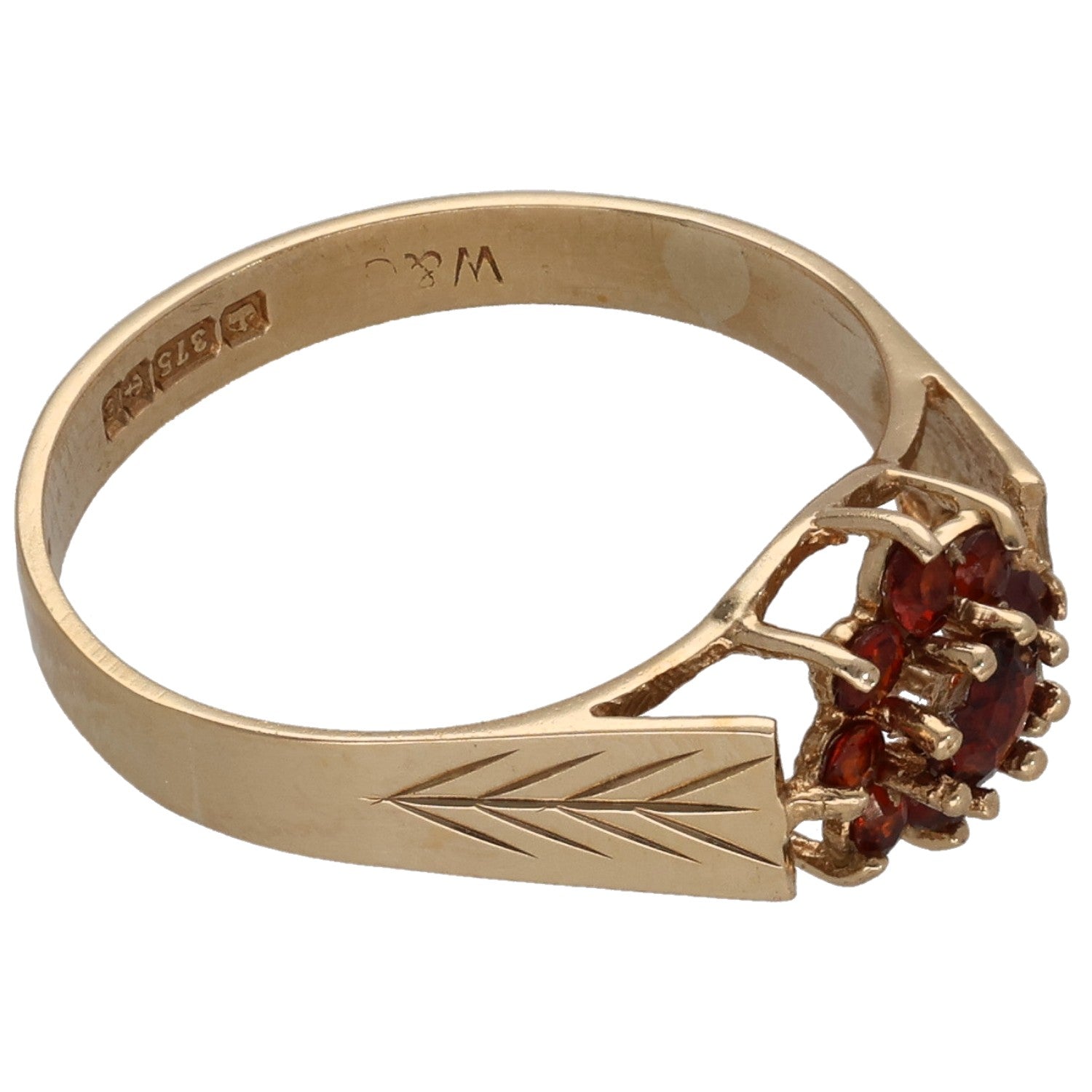 9ct gold garnet cocktail ring, side view with red gemstone cluster and geometric band etching