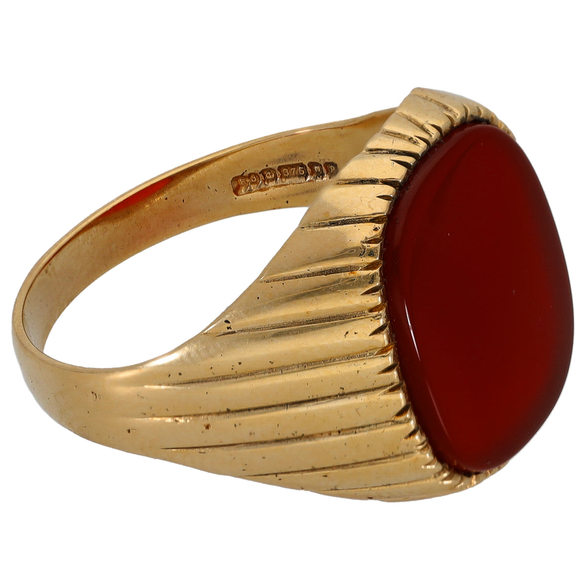 Gold signet ring with round red carnelian stone, side view