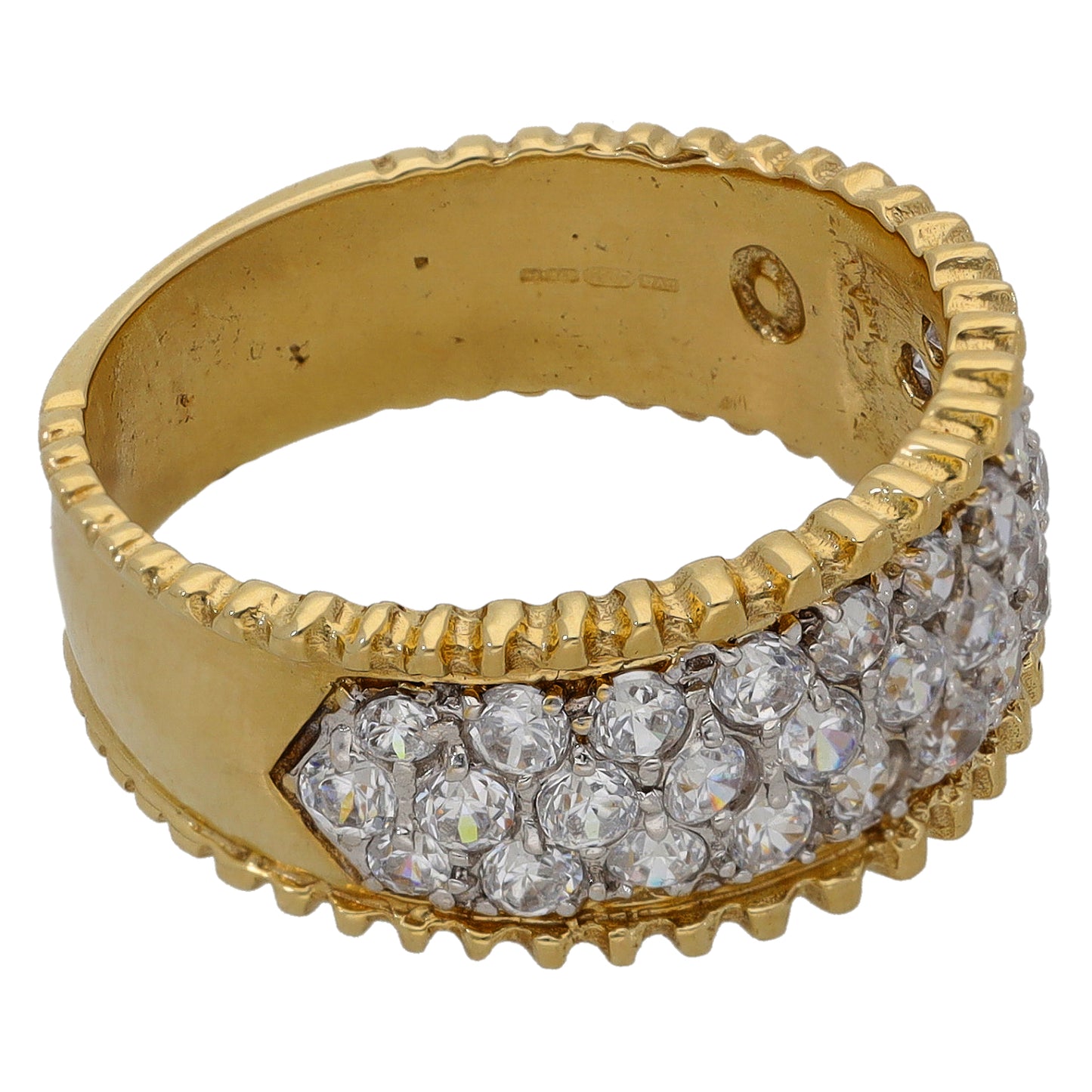 Gold-tone ring with textured edge and cluster of clear round stones across band