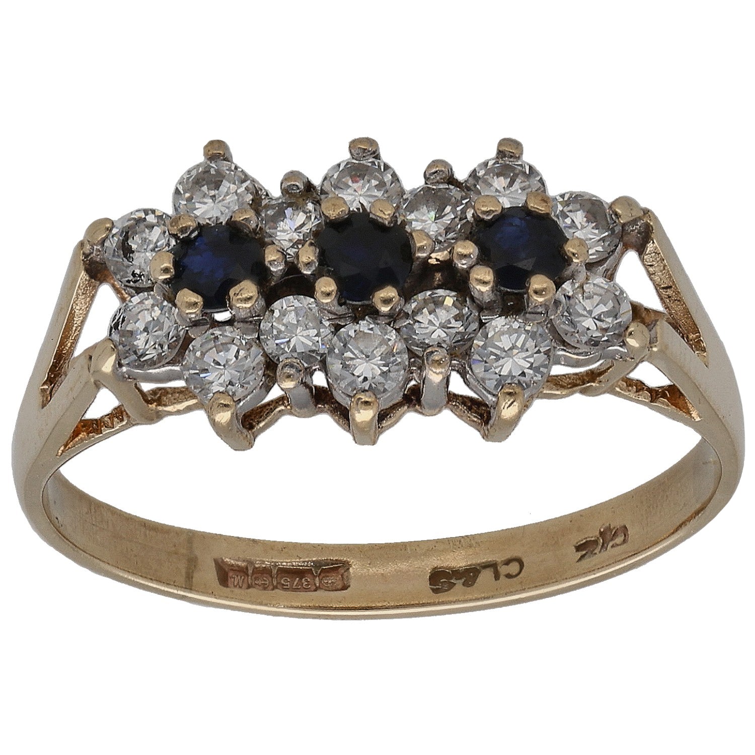 Gold dress ring with cluster of dark blue and clear crystal stones