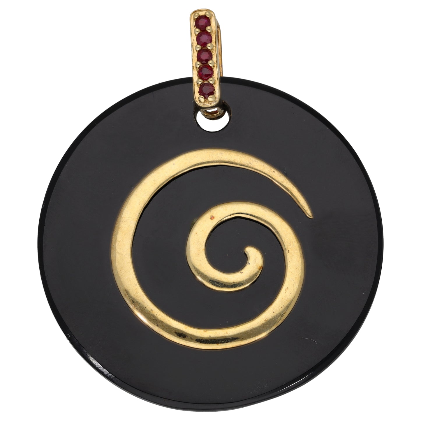 Gold tone pendant with black onyx round disc, gold swirl, and ruby red stone bail