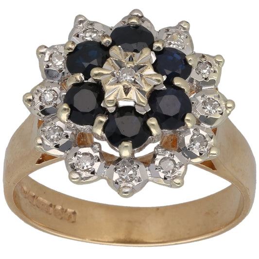 9ct gold ring: round dark sapphire center with diamond halo clusters