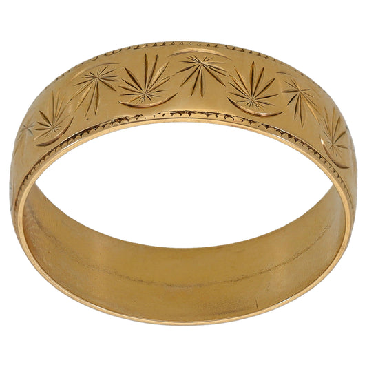 9ct gold patterned wedding ring with engraved starburst leaves
