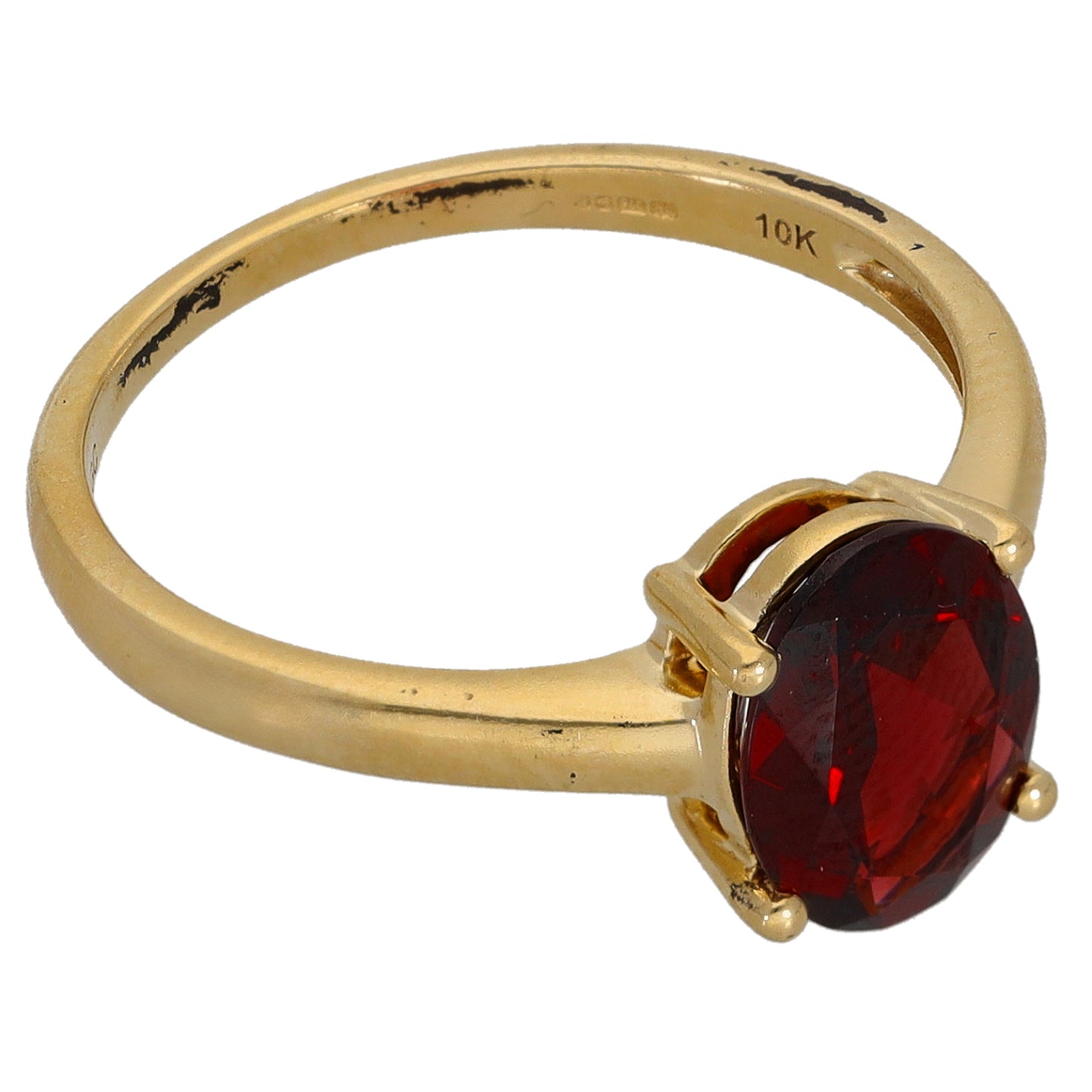 Gold single-stone ring with oval red garnet bezel, side view with 10k marking