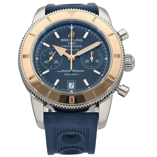 Two-tone Breitling chronograph-style wristwatch with blue dial and rubber strap