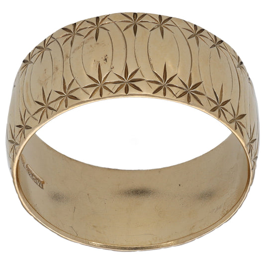 9ct gold patterned wedding ring with leaf engravings, polished band.